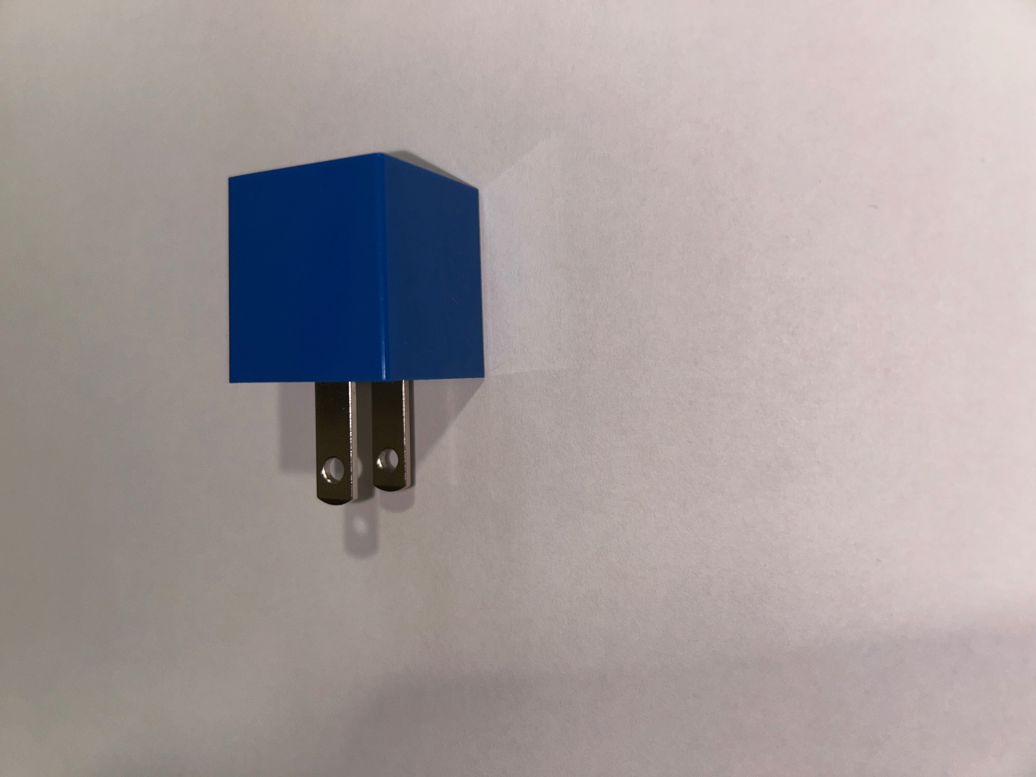 A simple image of the charging block of which you can only see the top and left faces