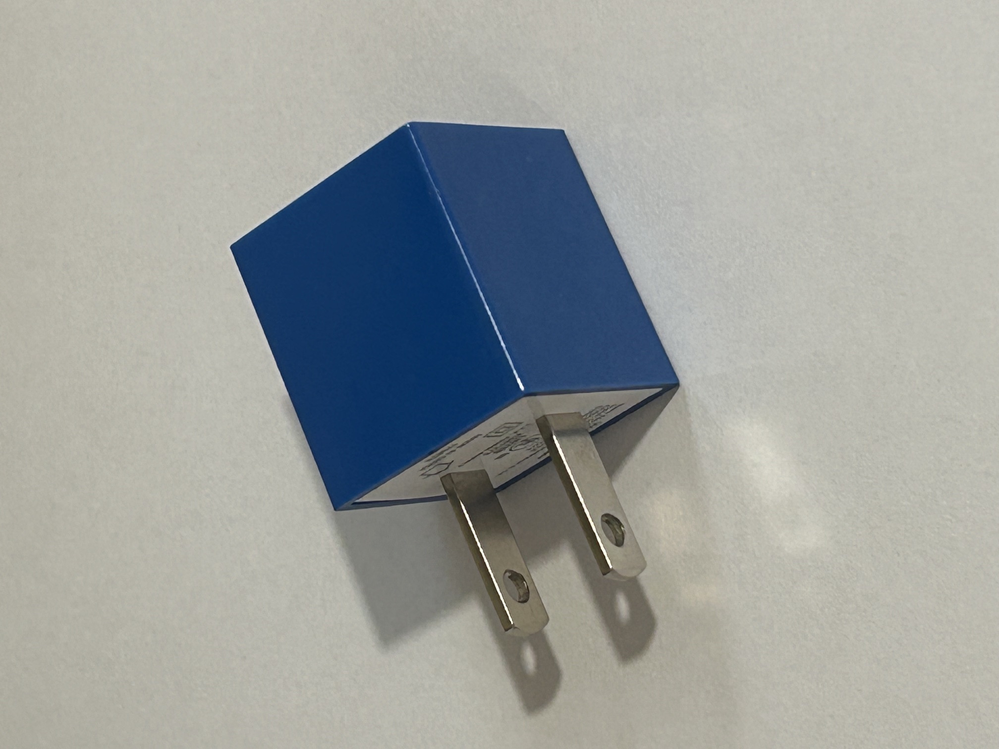 The charging block is exposed to a light from the top right of the image as a simple light study