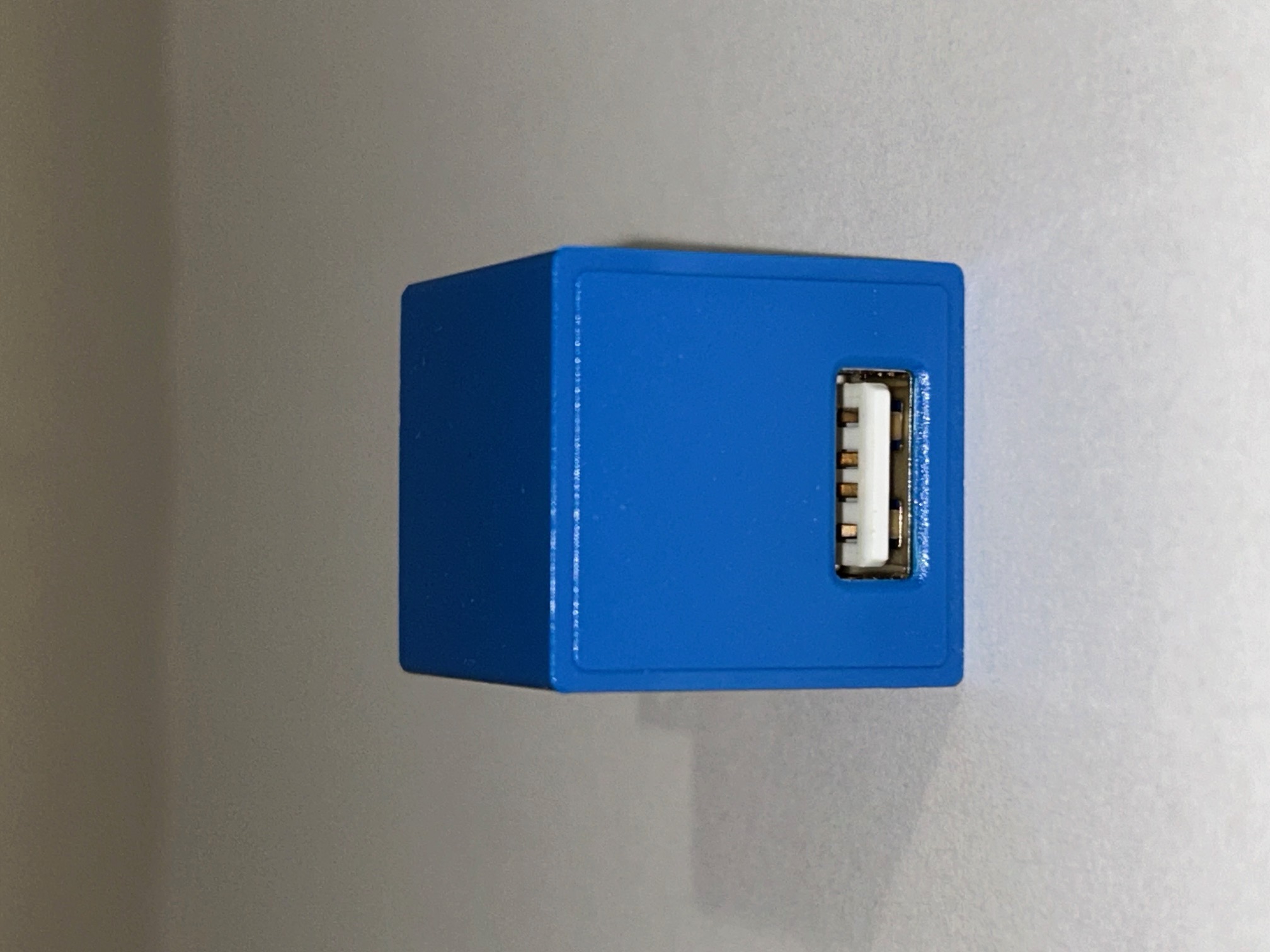 The block is placed right side up to take a look at the USB port in more detail