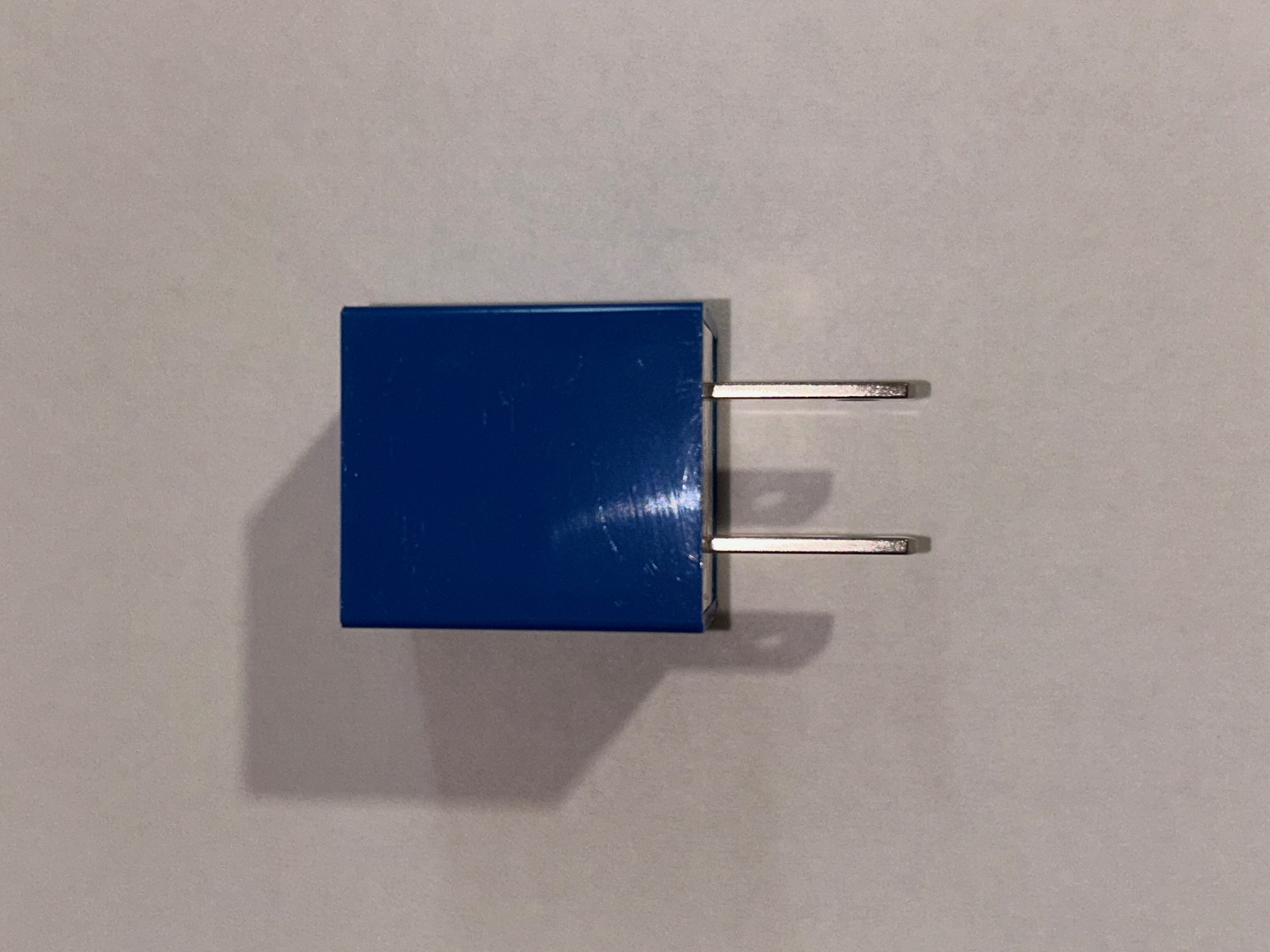 Focusing the light on the top side of the metal bits to see where the bevels might go and how big they are